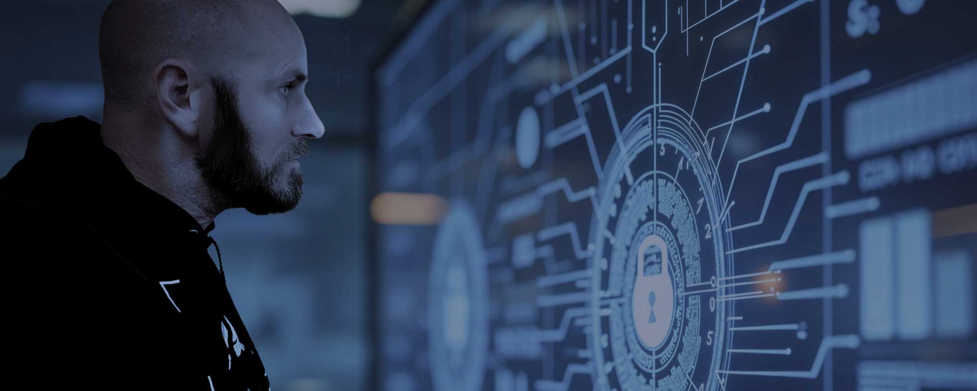 NRC's George Probst looking at a large display of security information.